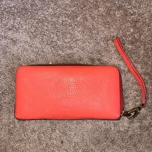 FOSSIL GUC ORANGE WALLET. Callouts pictured on the trim & inside the card slot.